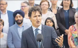  ?? CP PHOTO ?? Prime Minister Justin Trudeau speaks to the media at the Liberal cabinet retreat in Sudbury, Ont., on Monday. With two of his cabinet ministers in the news over their expense claims, Trudeau is under increasing pressure to outline how he plans to control spending.