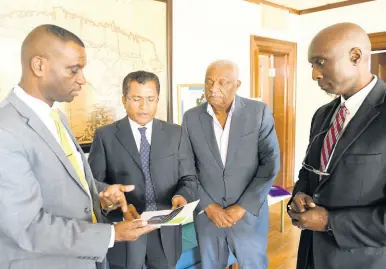  ?? RICARDO MAKYN/CHIEF PHOTO EDITOR ?? President of The Mico University College, Dr Asburn Pinnock (left), talks with Indian High Commission­er M. Sevala Naik (second left) about a private-sector-led initiative to construct a US$1m STEM Centre at the Kingston campus. The centre will serve all 14 parishes through satellite centres. With them are Cari-Med boss Glen Christian (second right), who is leading the project, and Mico’s Dr Albert Benjamin. They met at The Gleaner last Thursday to discuss the project.