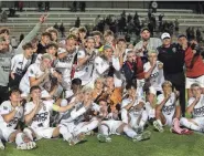  ?? PHOTOS BY NADIA ZOMORODIAN/NEWS-JOURNAL ?? Boca Raton players celebrate their win against Windermere on Thursday during the FHSAA 2024 soccer tournament hosted by Deland at Spec Stadium.