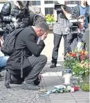  ?? Picture: AP. ?? A man lays flowers at the site in the city’s old town.