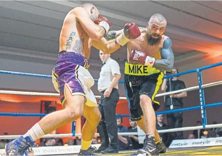  ?? Photograph: Allan Picken Below: Barry McGuigan ?? Mike Towell, right, fighting against Welsh boxer Dale Evans at Glasgow’s Radisson Blu Hotel on Thursday