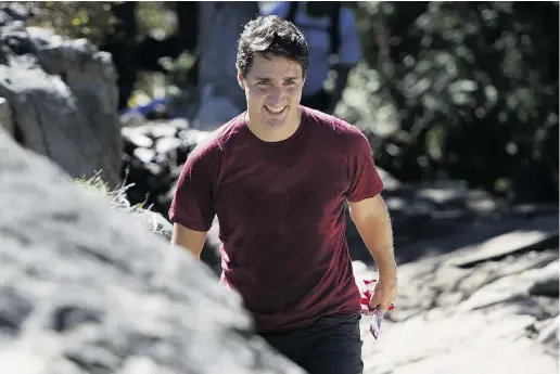  ?? Jonathan haywa rd / the cana dian press ?? Justin Trudeau climbs the famous Grouse Grind during an election campaign stop in North Vancouver on Friday.