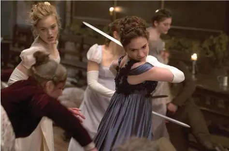  ?? ALL ?? Lily James, left, as Elizabeth Bennet and Bella Heathcote, right, as Jane Bennet in fighting mode in “Pride and Prejudice and Zombies.” DVD and Blu-ray editions of the film hit May 31.
