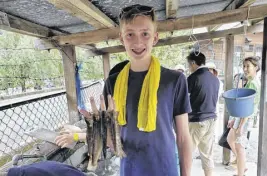  ?? CONTRIBUTE­D PHOTO ?? Student Ryan Glidden-mckay learned a thing or two about fresh fish on his exchange trip to Japan.