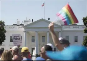  ?? PHOTOS BY THE ASSOCIATED PRESS ?? FILE - In this Sunday, June 11, 2017 file photo, Equality March for Unity and Pride participan­ts march past the White House in Washington. Most LGBT-rights activists never believed Donald Trump’s campaign promises to be their friend. With his move to...