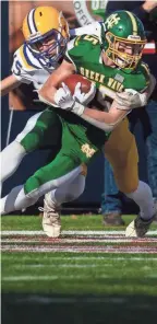  ?? ?? Newark Catholic’s Kyle Langenbrun­ner fights for yardage.