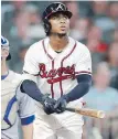  ?? ATLANTA JOURNAL-CONSTITUTI­ON ?? Braves infielder Ozzie Albies hit a pair of home runs against the Jays on Wednesday in Atlanta.