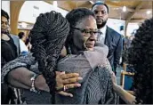  ?? SHABAN ATHUMAN/THE DALLAS MORNING NEWS ?? Allison Jean embraces hers son’s friends following a prayer vigil for Botham Shem Jean in Dallas.