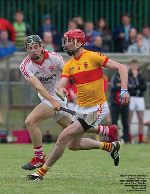  ??  ?? Mallow’s Denis Hayes tries to shake off Blarney’s Mark Coleman as the sides met in the County Premier Intermedia­te Hurling Championsh­ip Photo by Eric Barry