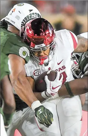  ?? NWA Democrat-Gazette/CHARLIE KAIJO ?? Arkansas running back Devwah Whaley rushed for a career-high 165 yards during Saturday’s loss to Colorado State. The Razorbacks had 80 rushing yards and passed for 353 in the season opener against Eastern Illinois, while rushing for 299 and passing for 138 against Colorado State.