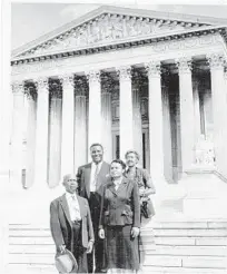  ?? DOVEY JOHNSON ROUNDTREE/OURTESY ?? Dovey Johnson Roundtree, center, and her first legal partner,Julius Winfield Robertson, at the Supreme Court circa 1955.