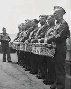  ??  ?? Members of the Home Guard in Blackburn train racing pigeons to carry messages in 1940