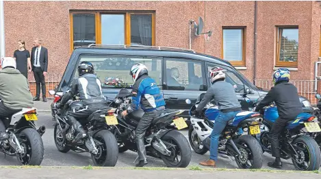  ?? Pictures: Dougie Nicolson. ?? The hearse drove past the line of bikers after their funeral tribute.