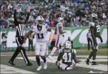  ?? SETH WENIG — THE ASSOCIATED PRESS ?? Bills wide receiver Zay Jones tosses the ball aside after scoring a touchdown against Jets cornerback Buster Skrine during the third quarter of Sunday’s game in East Rutherford, N.J.