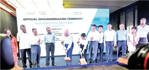  ??  ?? Najib (fifth left) and Ma (sixth left) officially launch the groundbrea­king ceremony yesterday for the KLIA Aeropolis DFTZ Park. — Bernama photo