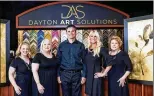  ??  ?? Dayton Art Solutions staff. The business specialize­s in large format printing, framing and digital restoratio­n.