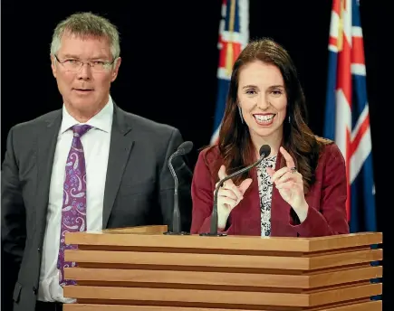  ?? PHOTO: GETTY IMAGES ?? Prime Minister Jacinda Ardern speaks while Minister for Economic Developmen­t David Parker looks on during a post Cabinet press conference at Parliament yesterday in Wellington.