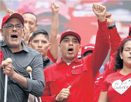  ?? REUTERS ?? Pedro Tellechea, Venezuela’s oil minister and president of state oil company PDVSA, centre, and Jorge Rodriguez, Venezuela’s National Assembly president, at an event in Caracas on March 25.
