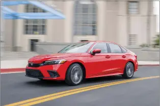  ?? AMERICAN HONDA MOTOR CO. VIA AP ?? This photo provided by Honda shows the 2024 Civic. It’s available as a sedan or a hatchback with a larger cargo area.
