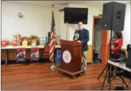  ??  ?? Rensselaer County Legislator Gary Pavlic shows and read from a diary kept by his father, who served in the military.