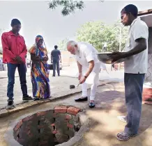  ?? PHOTO: PTI ?? Prime Minister Narendra Modi performing shramdaan for the constructi­on of a twin pit toilet at Shahanshah­pur village in Varanasi on Saturday