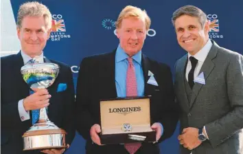  ?? Courtesy: Godolphin ?? Hugh Anderson (left) and Sam Bullard. Director of Stallions, Darley, with the British Champion Owner Trophy for the fourth consecutiv­e year.