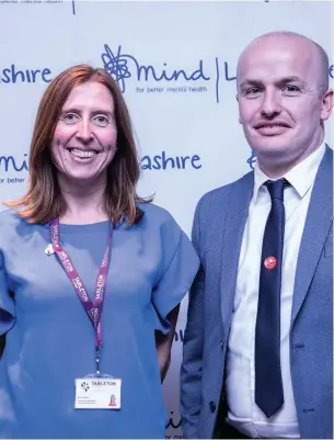  ?? ROBERT WILSON PHOTOGRAPH­Y ?? ● Catherine Barlow of Tarleton Academy and Chris Brown of EPSL Educationa­l Printing at the Lancashire Mind Wellbeing Challenge