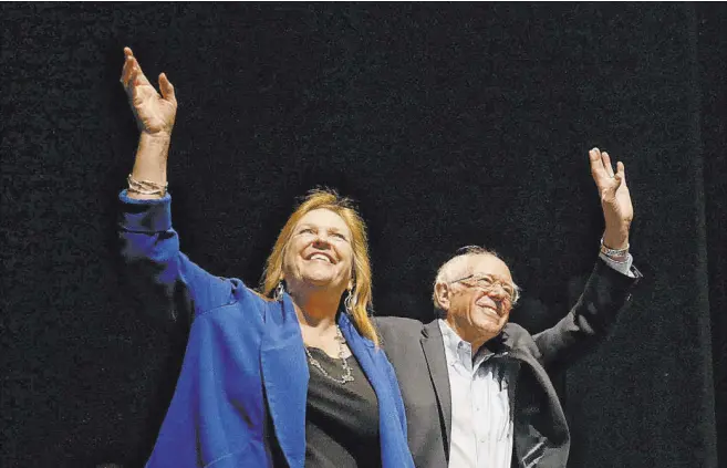  ?? Briana Sanchez The Associated Press ?? Democratic presidenti­al candidate Sen. Bernie Sanders, I-Vt., takes the stage with his wife, Jane, for a rally Saturday in El Paso, Texas.