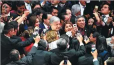  ??  ?? New Mexican President Andres Manuel Lopez Obrador celebrates with supporters before his swearing-in at a ceremony in the Chamber of Deputies in Mexico City on Saturday.