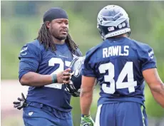  ?? JOE NICHOLSON / USA TODAY SPORTS ?? Eddie Lacy (left) make his first trip to Green Bay in Week 1 since the running back signed with the Seahawks this off-season instead of the Packers.