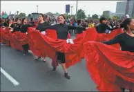  ?? MARIANA BAZO / REUTERS ?? Women dance during an internatio­nal day of protest against discrimina­tion and violence against women in Lima, Peru, on Saturday.