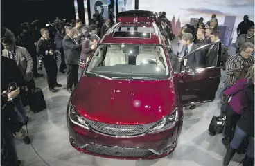  ?? ANDREW HARRER / BLOOMBERG NEWS ?? The new Chrysler Pacifica is unveiled at the Detroit auto show on Monday. The former
Town & Country was renamed to appeal to more than “soccer moms,” the CEO says.