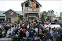  ?? THE ASSOCIATED PRESS ?? People line up as they wait for the grand opening of Bass Pro Shops Outpost store April 15, 2015, in Atlantic City, N.J.