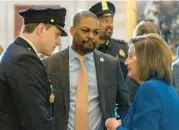  ?? ALEX BRANDON/AP 2022 ?? Washington Metropolit­an Police Department Officer Daniel Hodges, left, and U.S. Capitol Police Officer Eugene Goodman, center, will be honored Friday.