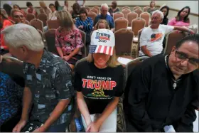  ?? PAUL SANCYA — THE ASSOCIATED PRESS ?? Lisa Mankiewicz sits in the audience during a training session for Women for Trump, An Evening to Empower, in Troy, Mich., Thursday. President Donald Trump’s campaign is rallying and training a corps of female defenders, mindful that Trump’s shaky standing with women could sink his hopes of reelection next year. Female surrogates and supporters fanned out across important battlegrou­nds Thursday in a high-profile push to make the president’s case on the economy and to train campaign volunteers.