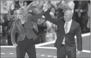  ?? AP/JOHN LOCHER ?? Former Rep. Gabrielle Giffords of Arizona and her husband, former astronaut Mark Kelly, acknowledg­e the crowd after speaking Wednesday at the Democratic convention. Giffords, who was seriously wounded in a 2011 shooting, and Kelly talked about the need...