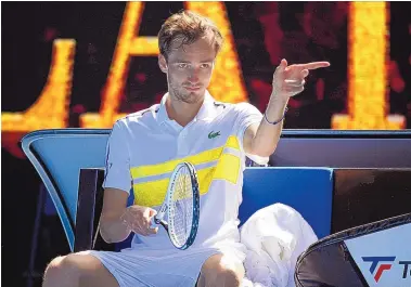  ?? ANDY BROWNBILL/ASSOCIATED PRESS ?? Daniil Medvedev was chatty, animated and his coach even left during play. But Medvedev still prevailed over Filip Krajinovic in their third-round Australian Open match on Saturday in Melbourne.