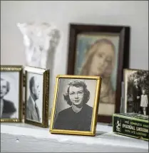  ?? EXPLORE GEORGIA/TNS ?? Family photos, including one of Flannery O’Connor, are among the artifacts at Andalusia Farm, where she lived the final 14 years of her life. The farm, where O’Connor wrote most of her books and short stories, is set on more than 500 acres near Milledgevi­lle.