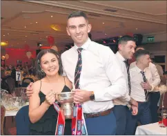  ?? Sheehan) (Pic: Catherine ?? HERE’S TO SUCCESS - Emma and Shane Beston with the All-Ireland club hurling trophy at last Friday’s victory social.