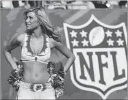  ?? DOUG BENC GETTY IMAGES FILE PHOTO ?? Dolphins cheerleade­rs need special qualificat­ions.