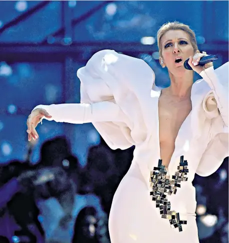  ??  ?? Wearing her heart on her sleeve: Céline Dion performing at this year's Billboard Music Awards, above; and with her late husband René Angélil, below