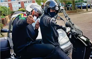  ??  ?? Getaway: Shameless moped muggers strike a pose in Knightsbri­dge, central London