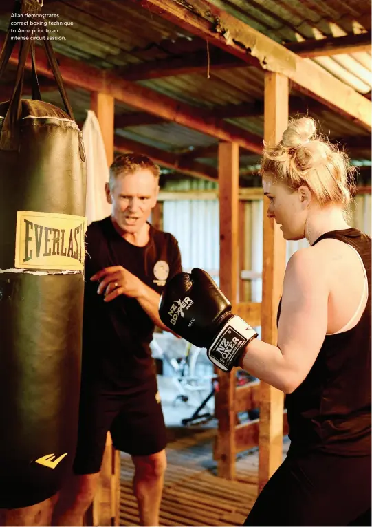  ??  ?? Allan demonstrat­es correct boxing technique to Anna prior to an intense circuit session.