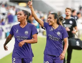  ?? Stephen M. Dowell / Tribune News Services ?? National team players like American Sydney Leroux, left, and Brazilian Marta won’t be playing in the NWSL tournament after the Orlando Pride pulled out.