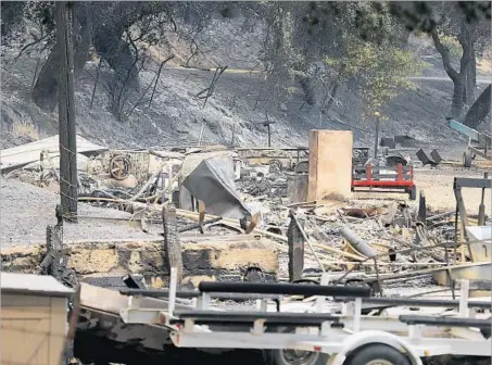  ?? Photograph­s by Allen J. Schaben Los Angeles Times ?? THE WHITTIER FIRE near Lake Cachuma scorched just over 12 square miles and burned 20 structures on both sides of Highway 154.