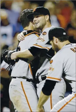  ?? FRANK FRANKLIN II — THE ASSOCIATED PRESS ?? Giants starting pitcher Chris Heston, center, celebrates with teammates after throwing a no-hitter against the New York Mets at Citi Field on June 9, 2015, as the Giants won 5-0.