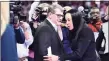  ?? Sean Rayford / Associated Press ?? UConn coach Geno Auriemma, left, and South Carolina coach Dawn Staley shake hands. The two teams are scheduled to meet in Ferbruary.