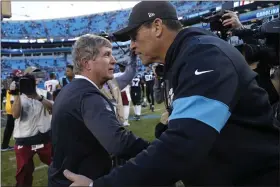  ?? BRIAN BLANCO — THE ASSOCIATED PRESS ?? Redskins interim coach Bill Callahan and Panthers coach Ron Rivera speak following a game Dec. 1in Charlotte, N.C.