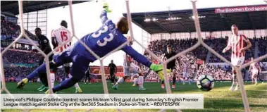  ??  ?? Liverpool’s Philippe Coutinho (centre) scores his team’s first goal during Saturday’s English Premier League match against Stoke City at the Bet365 Stadium in Stoke-on-Trent. – REUTERSPIX