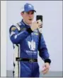  ?? THE ASSOCIATED PRESS ?? NASCAR Daytona 500 auto race pole sitter, Alex Bowman takes a selfie photo in Victory Lane after his qualifying run at Daytona Internatio­nal Speedway Sunday in Daytona Beach, Fla.